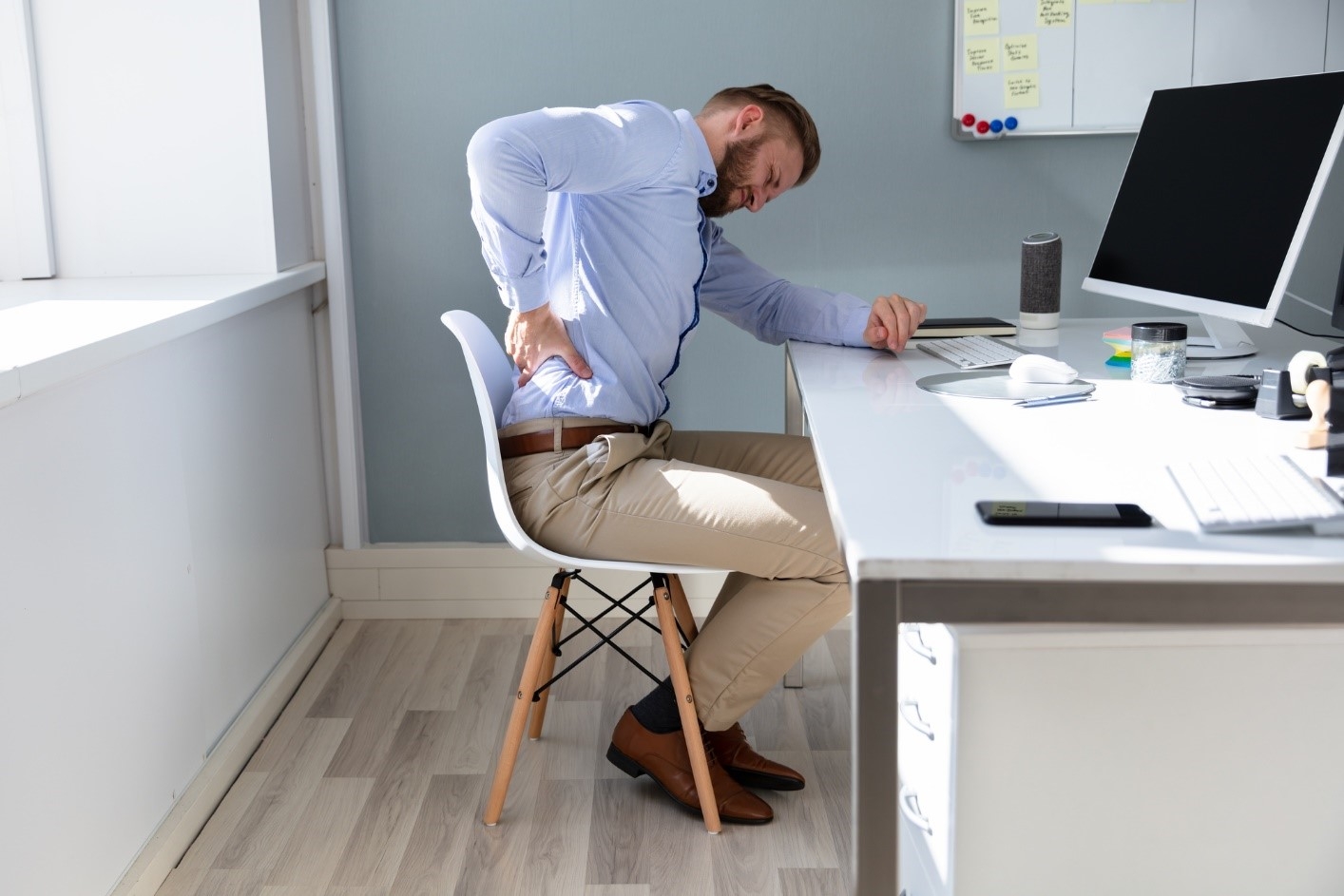 man sitting with back pain
